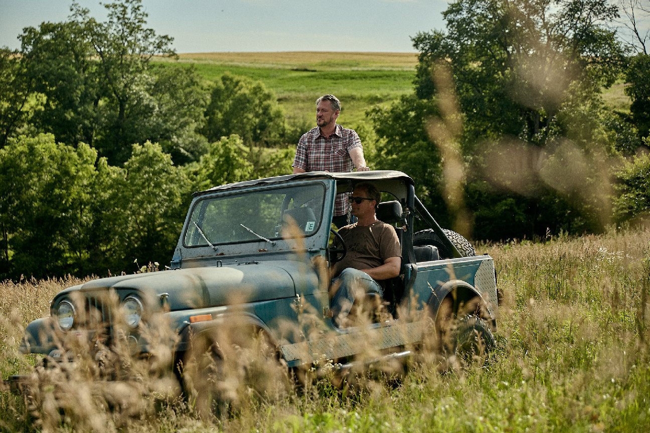 Men in jeep on a farming range