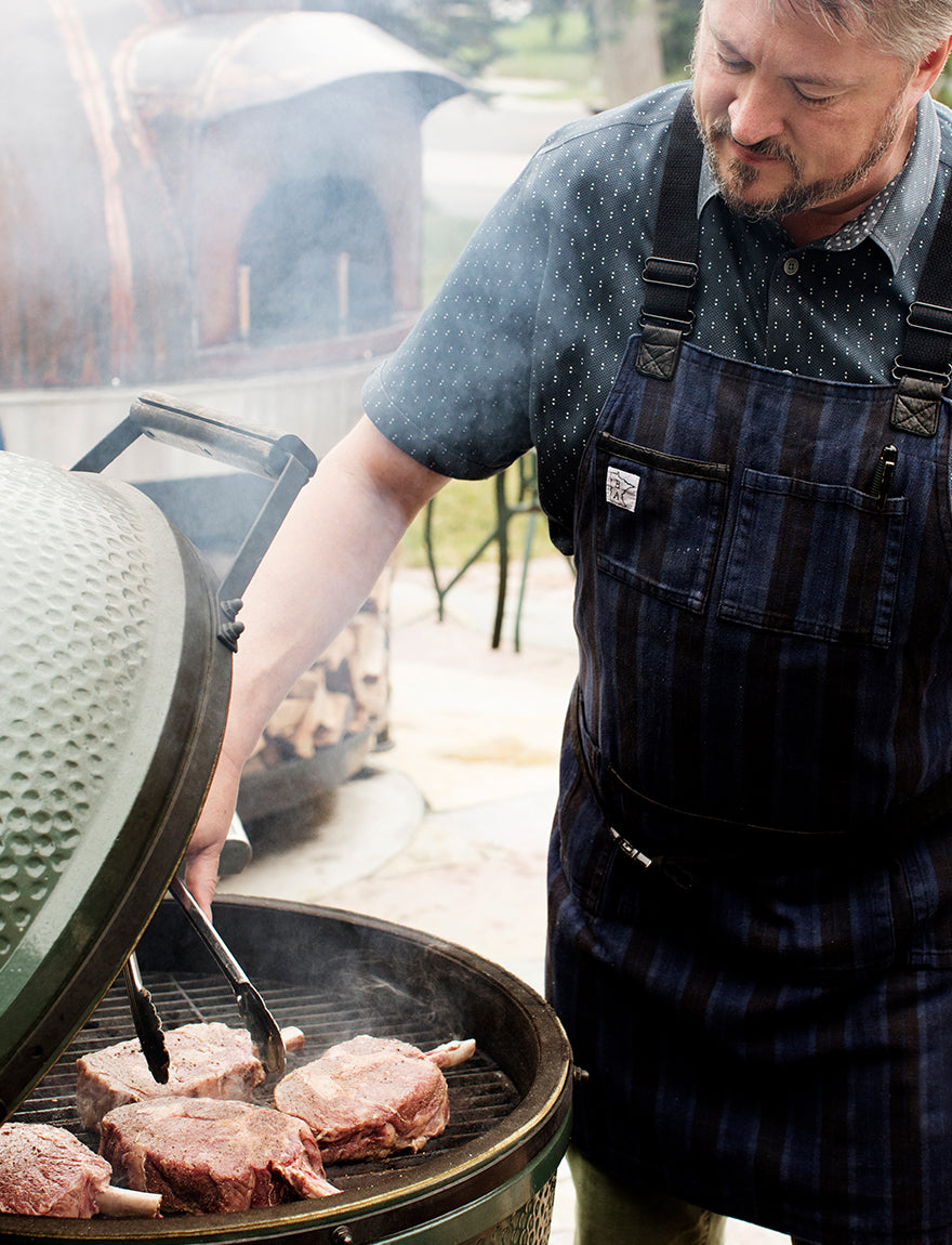 Man grilling steak