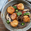 Wild-Caught Sea Scallops served with noodles, broth, and mushrooms topped with peppers - Market House