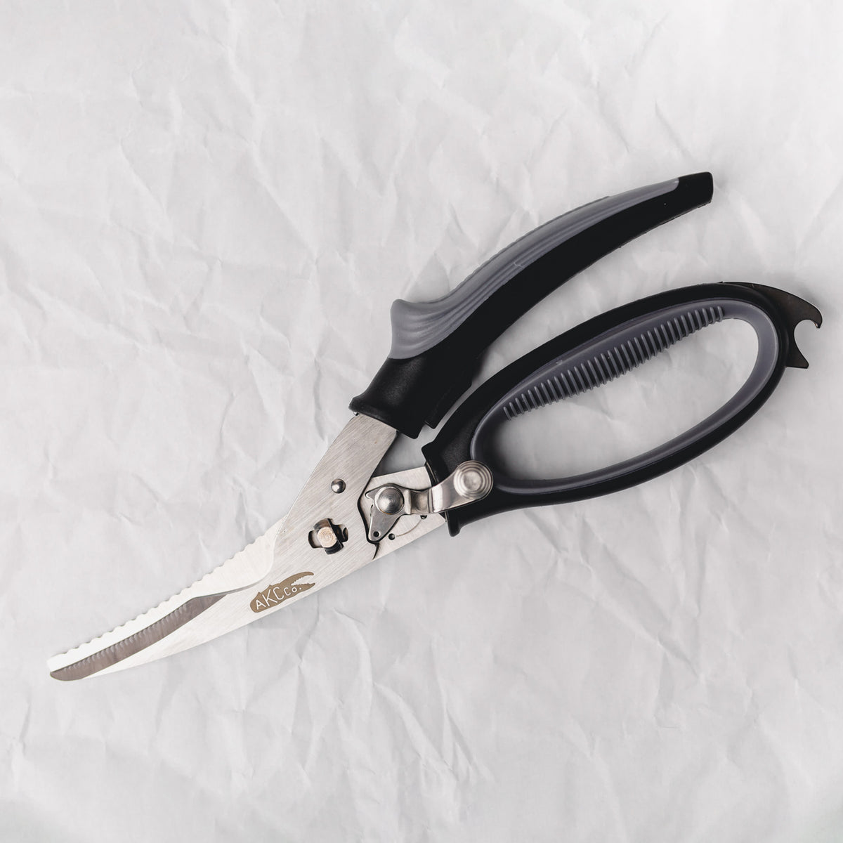 Pair of scissors with black handles on a white background