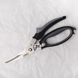 Pair of scissors with black handles on a white background