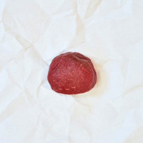 Raw Filet Mignon on white butcher paper