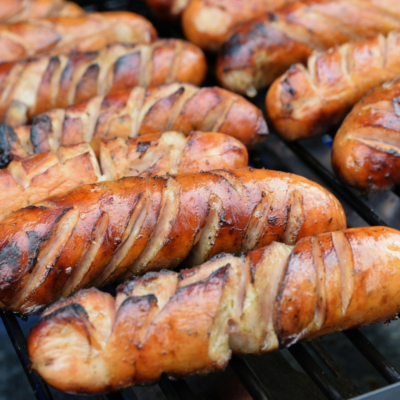 Close-up of grilled sausages on a grill