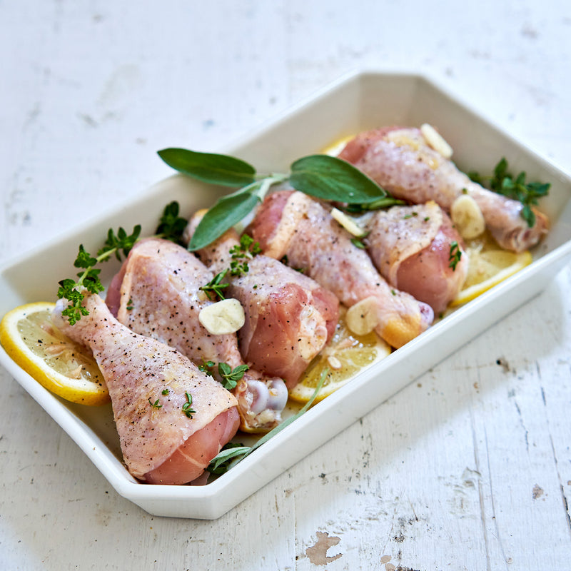 Raw seasoned chicken drumsticks