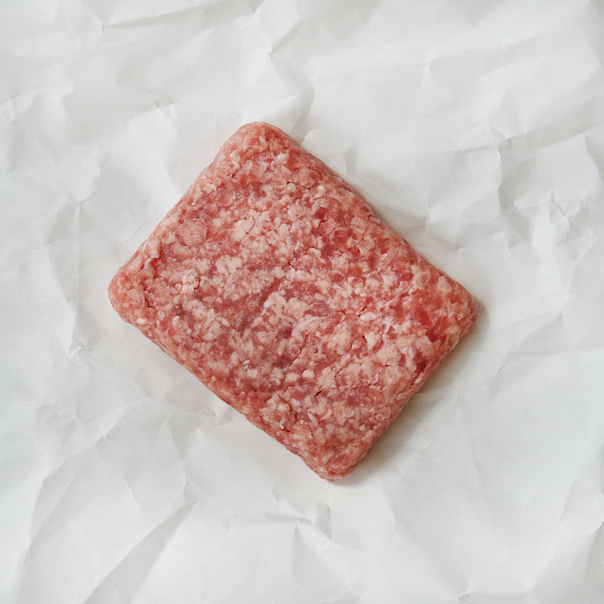 Ground veal on parchment paper