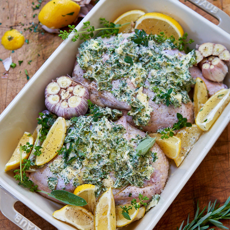 seasoned half chickens covered in butter and spices