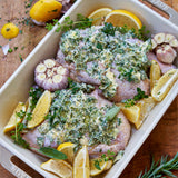 seasoned half chickens covered in butter and spices