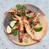 New Caledonia Blue Prawns cooked as skewers on grill and prepared on white platter
