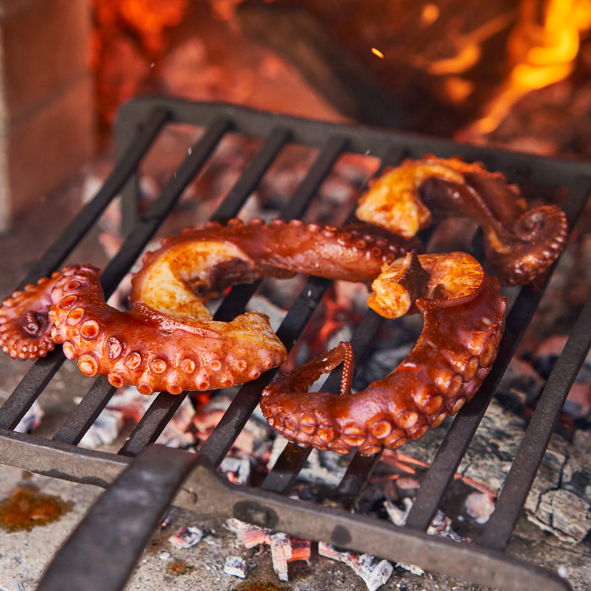 Octopus being cooked in a brick oven