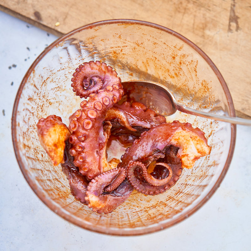 Octopus seasoned in a bowl 