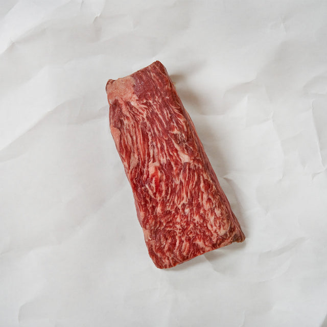 Marbled raw wagyu beef on a white background