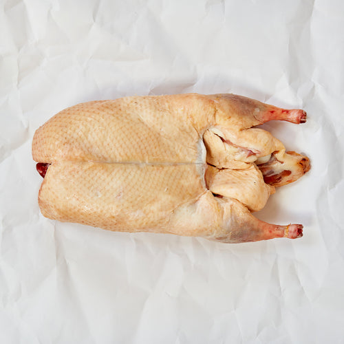 A whole Moulard duck on parchment paper 