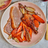 Cooked Moulard duck sliced with carrots and onions 