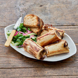 Center Cut Marrow Bones served with bread and salad - Market House