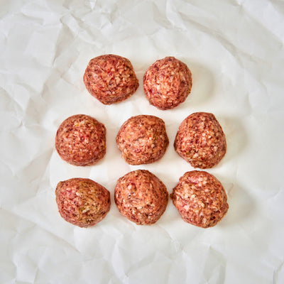 Mulay raw meatballs arranged on a white paper background