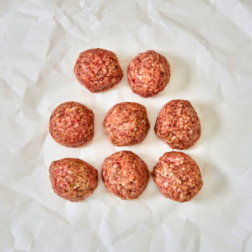 Mulay raw meatballs arranged on a white paper background