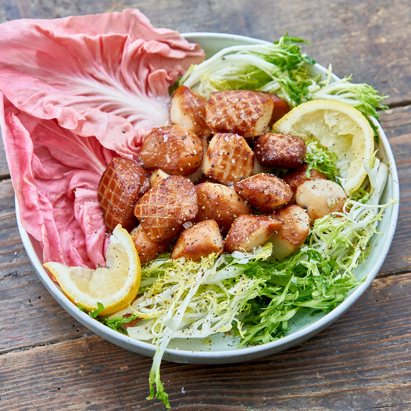 Smoked Weathervane Scallops served on a bed of lettuce with lemons- Market House
