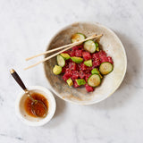 Tuna Poke with Avocado, cucumber, ginger and avocado and shoyu sauce in a bowl. 