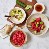 Tuna Poke with Avocado, cucumber, ginger and avocado and shoyu sauce in a bowl. 